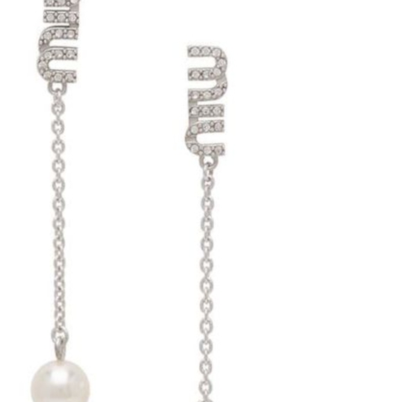 Mui Mui Pair of drop earrings in sterling silver. Swarovski.